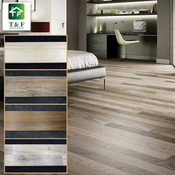 Les carreaux de céramique vitrés de grain en bois glissent non 200x1000mm que les bruns/bronze la couleur